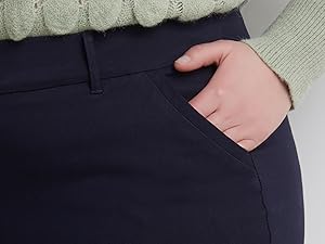 model wearing navy pant, hand in her pocket