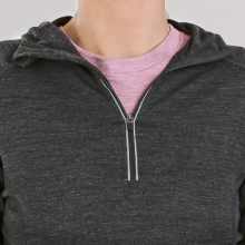 women wearing a merino wool half-zip thermal long sleeve hoodie with the zipper down