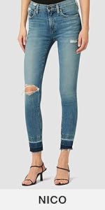 A woman wearing skinny, torn jeans.