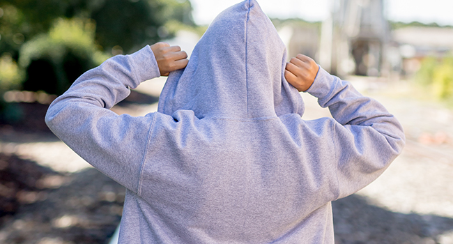 Female model wearing Brisco Brands zip up sweatshirt